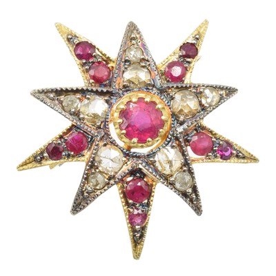 Lot 112 - A ruby and diamond star brooch