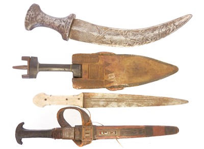 Lot Four African / Ethnic daggers, two with...