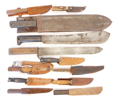 Lot Three machettes and eight other knives and...