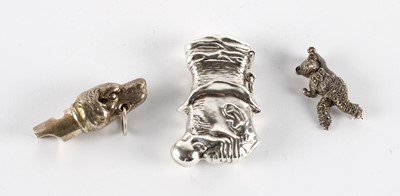 Lot 41 - A Novelty Silver 'Mr. Punch' Vesta Case, Dog Whistle and Monkey Brooch
