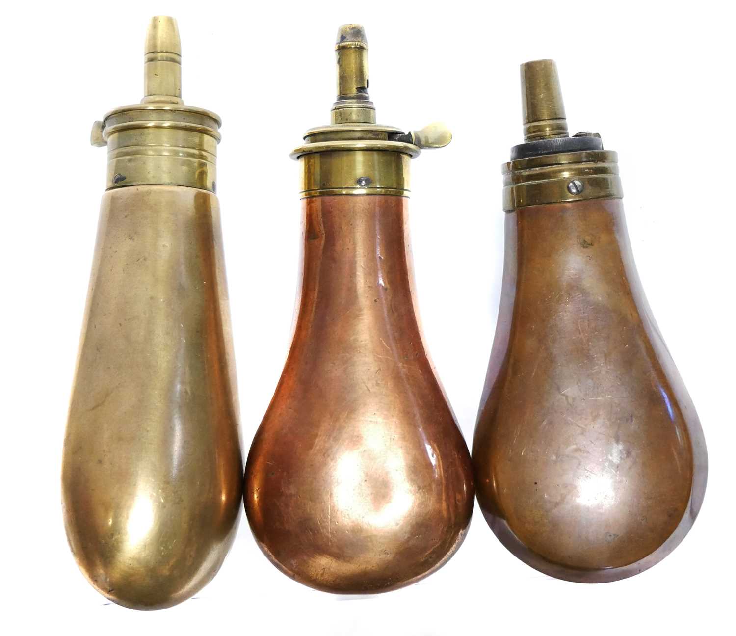 Lot 134 - Three pistol size copper and brass powder