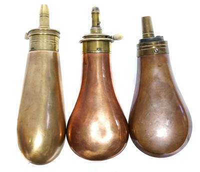 Lot 134 - Three pistol size copper and brass powder flasks.