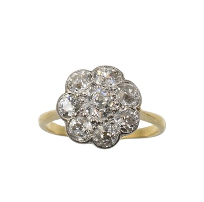 Lot An 18ct gold and diamond floral ring
