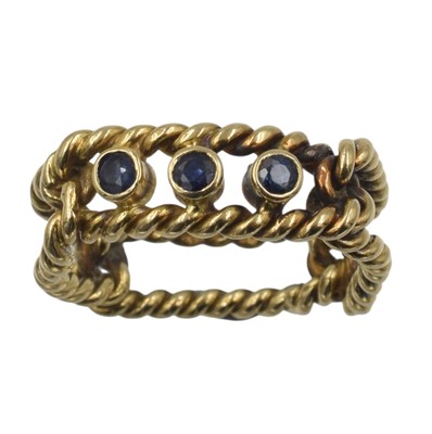 Lot An 18ct gold and sapphire rope ring