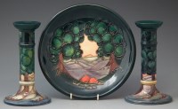 Lot 239 - Pair of Moorcroft candlesticks and a matching
