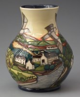 Lot 254 - Moorcroft landscape vase boxed.