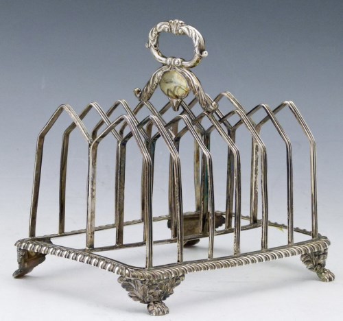 Lot 297 - George IV silver toast rack.