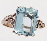 Lot 328 - Emerald cut aquamarine and diamong ring.