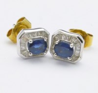 Lot 330 - Pair of sapphire and diamond earrings.