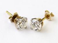 Lot 333 - Pair of single stone diamond ear studs.