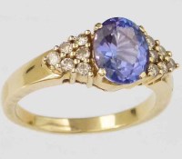 Lot 334 - Oval tanzanite and diamond ring in unmarked gold
