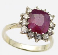 Lot 352 - Ruby and diamond cluster ring.