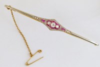 Lot 357 - Edwardian ruby and diamond bar brooch in gold and