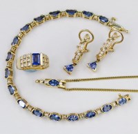 Lot 369 - 14K gold and tanzanite line bracelet also