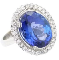 Lot 376 - Tanzanite and diamond oval cluster ring.