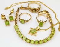 Lot 377 - Unmarked peridot and gold line bracelet; unmarked