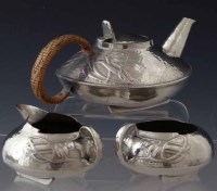 Lot 13 - Archibald Knox compressed teapot and  Archibald