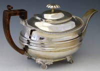 Lot 248 - George III silver tea pot.