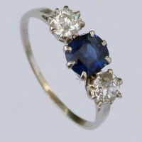 Lot 263 - Sapphire and diamond three-stone ring in platinum