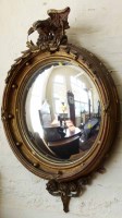 Lot 429 - Convex circular gilt wall mirror with eagle