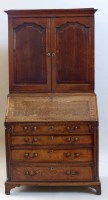 Lot 433 - Oak bureau with two door cupboard to upper