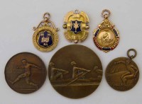 Lot 2 - Two 9ct gold sporting medals and one other, and