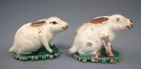 Lot 147 - Pair of pottery rabbits.