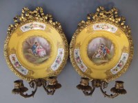 Lot 156 - Pair of sevres style candlestick wall plaques.