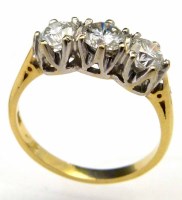 Lot 243 - Three stone diamond ring.