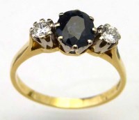 Lot 250 - Three stone sapphire and diamond ring.