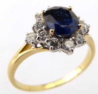 Lot 255 - Sapphire  and diamond oval cluster
