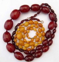 Lot 263 - Yellow amber necklace and a red amber necklace.
