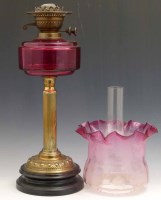 Lot 14 - Victorian ruby glass oil lamp complete with