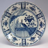 Lot 95 - Delft charger   painted with a peacock perched on