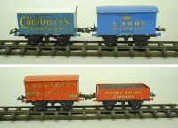 Lot 31 - Hornby Series O gauge, four various freight wagons: Carr's Biscuits; Cadbury's Chocolates; Crawford's Biscuits and Hornby coal truck. (4)
