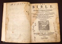 Lot 102 - Breeches Bible, printed by Christopher Barker, 1599, some early pages frayed and torn, brown calf, raised bands, six spine panels, various psalms wi