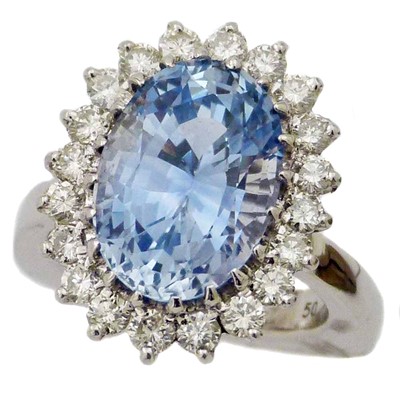 Lot 399 - An 18ct gold sapphire and diamond cluster ring by Mauboussin