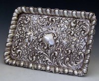 Lot 274 - Embossed silver dressing table tray.