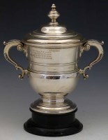 Lot 281 - A two-handled lidded trophy cup and a stand