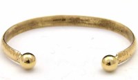 Lot 316 - 9ct gold slave bangle.