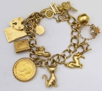 Lot 350 - Gold charm bracelet with soveriegn.