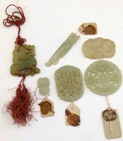 Lot 228 - Six Chinese jade pendants with wax seals.