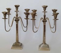 Lot 239 - Pair of silver plated four branch candlesticks