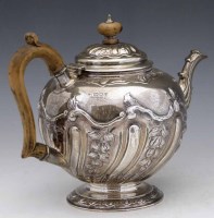 Lot 241 - Embossed silver teapot London 1908, 24oz 19dwt
