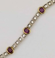 Lot 284 - Ruby and diamond 18ct gold line bracelet.