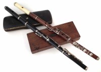 Lot 14 - Two rosewood flutes.
