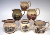 Lot 149 - Five pottery jugs and a large tankard, bat