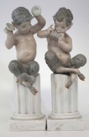 Lot 231 - Pair of Lladro Fauns, modelled playing pipes and