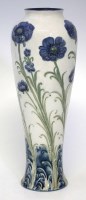Lot 227 - William Moorcroft, blue poppies balustre vase.
