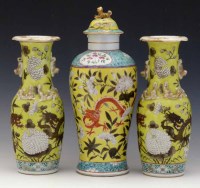 Lot 298 - Set of three Chinese yellow ground dragon vases.